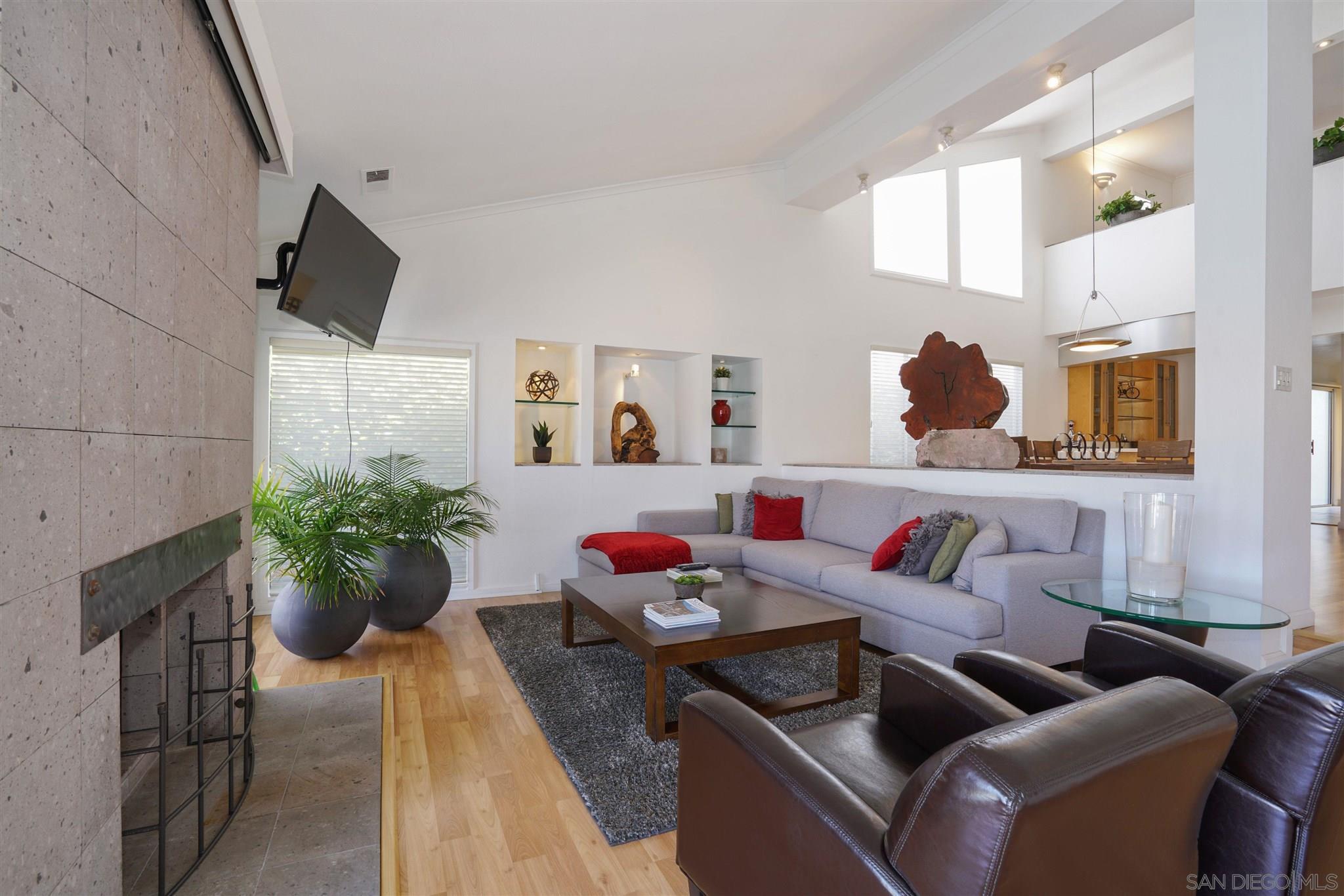 57 Blue Anchor Cay Road Coronado, CA 92118 - Photo 23 of 37 a living room with furniture and flowers