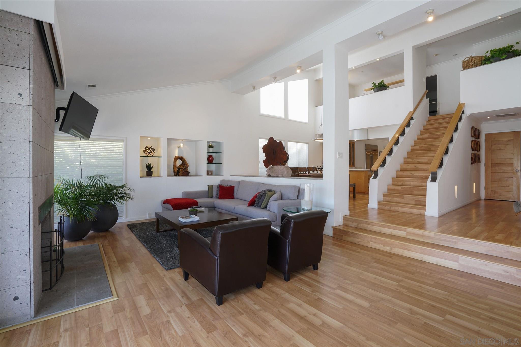 57 Blue Anchor Cay Road Coronado, CA 92118 - Photo 26 of 37 a living room with furniture and a potted plant