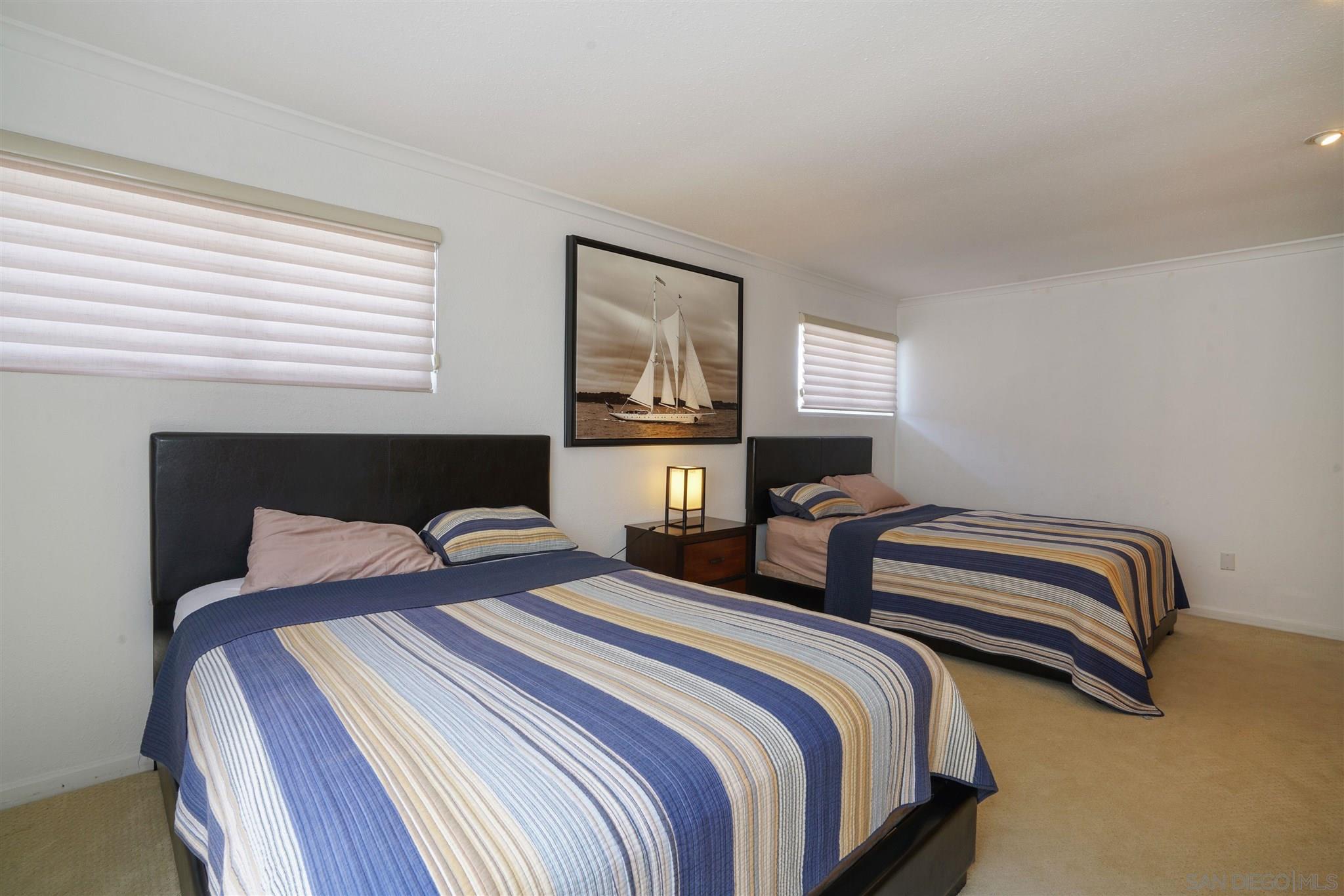 57 Blue Anchor Cay Road Coronado, CA 92118 - Photo 30 of 37 a bedroom with two beds and painting on the wall