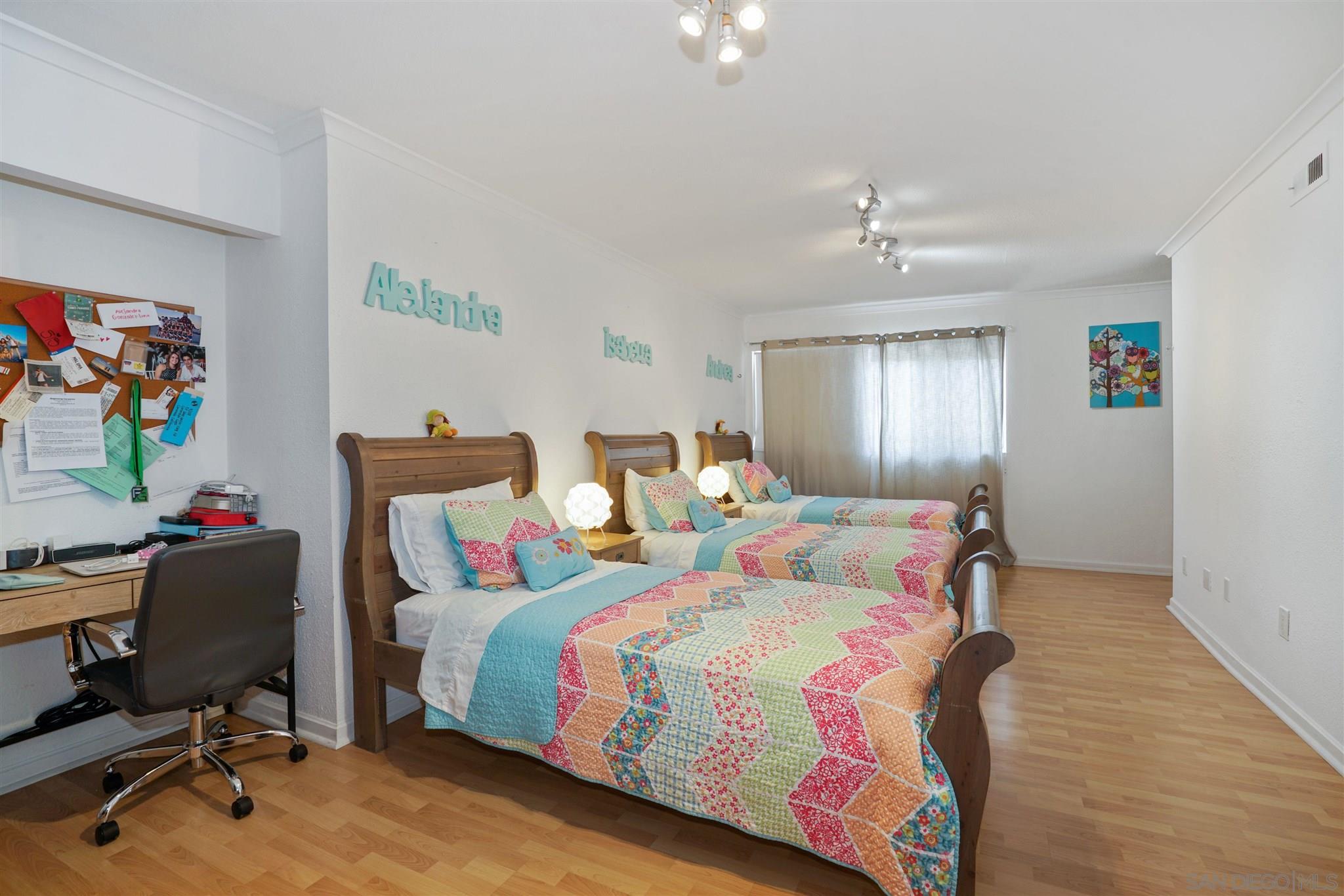 57 Blue Anchor Cay Road Coronado, CA 92118 - Photo 32 of 37 a bedroom with a bed and a desk