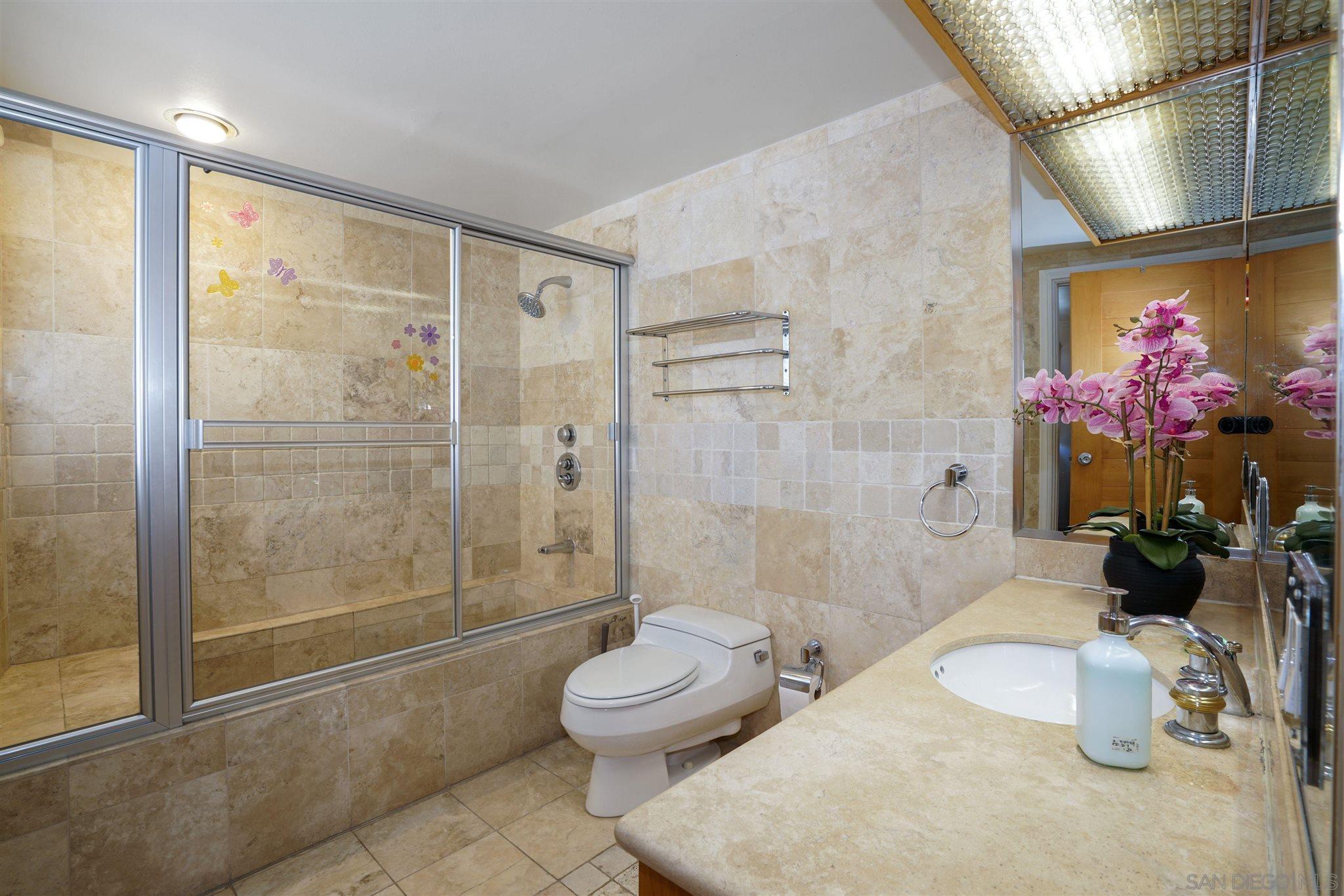 57 Blue Anchor Cay Road Coronado, CA 92118 - Photo 34 of 37 a bathroom with a sink mirror toilet and shower