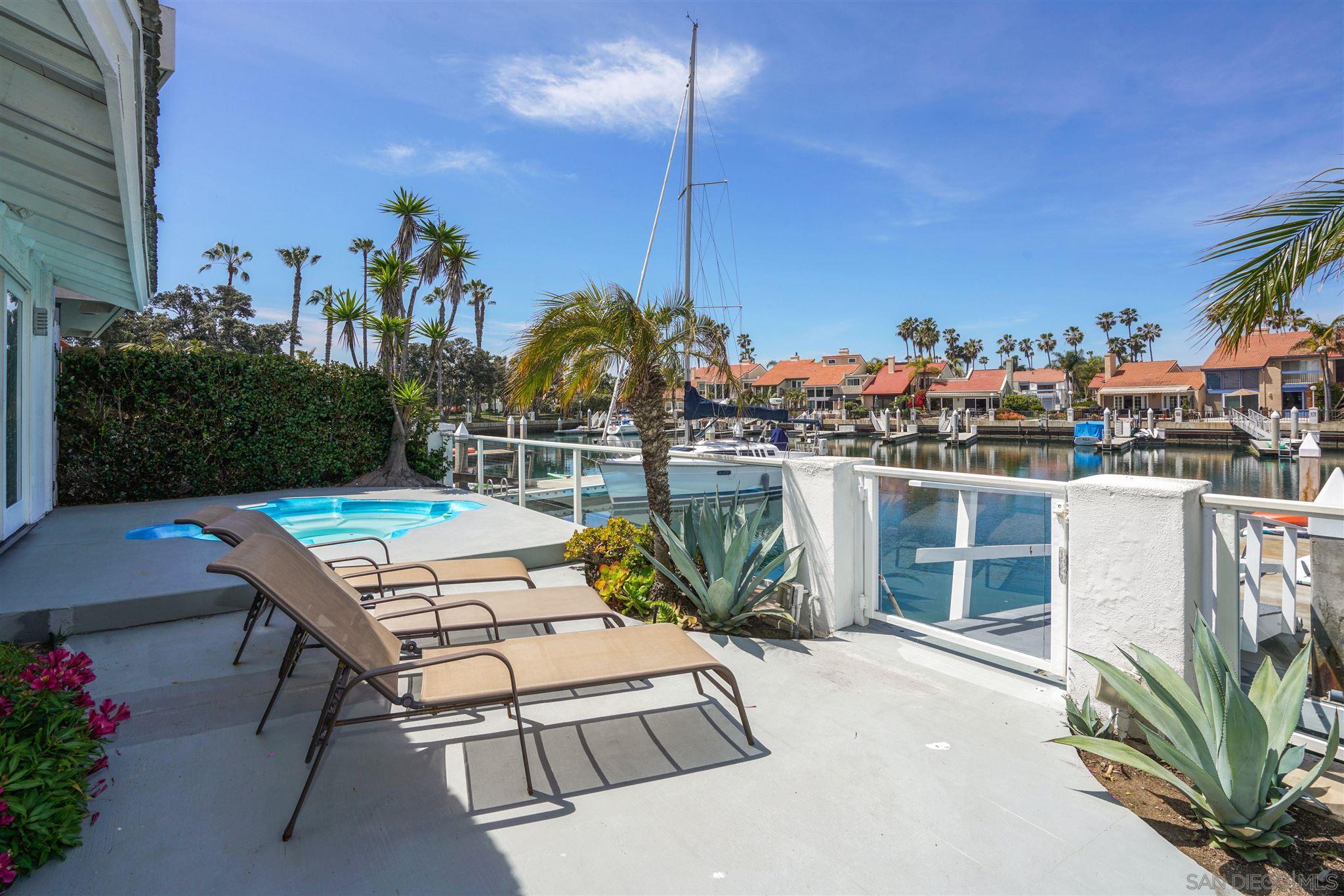 57 Blue Anchor Cay Road Coronado, CA 92118 - Photo 5 of 37 a view of a chairs and table in patio
