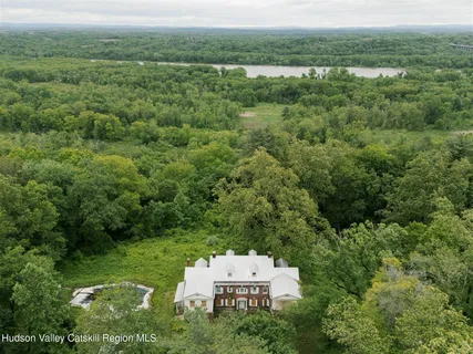 an aerial view of a house with a yard
