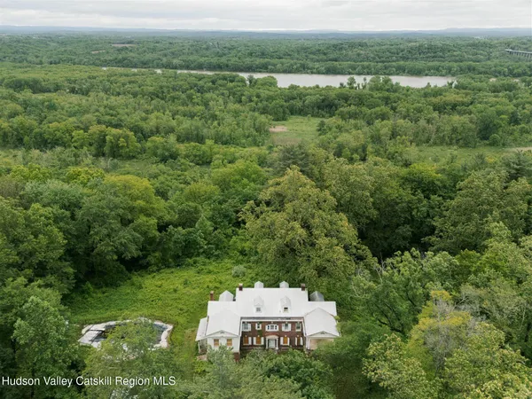 an aerial view of a house with a yard