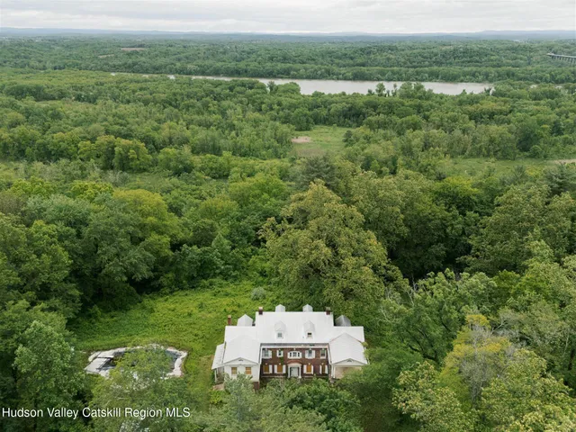 an aerial view of a house with a yard