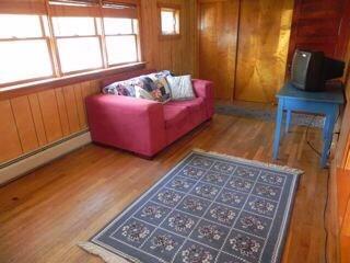 8 Crockett Point Road Bernard, ME 04612 - Photo 9 of 15 Living room with wood flooring and a...