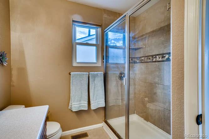 11181 Rodeo Circle Parker, CO 80138 - Photo 15 of 26 a bathroom with a bathtub and shower