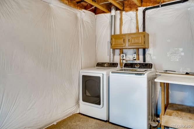 11181 Rodeo Circle Parker, CO 80138 - Photo 20 of 26 a utility room with dryer and washer