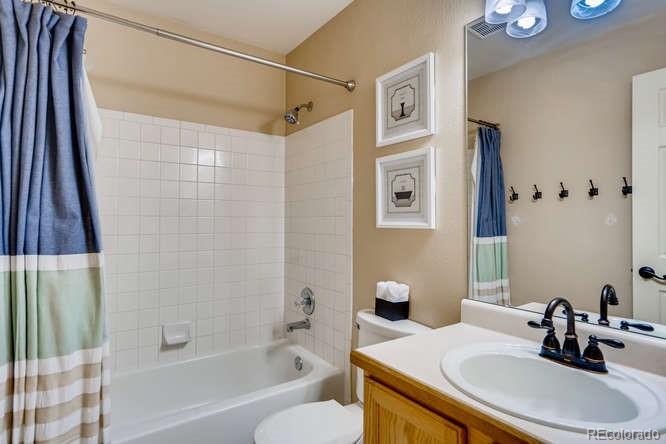 11181 Rodeo Circle Parker, CO 80138 - Photo 22 of 26 a bathroom with a sink a toilet and shower