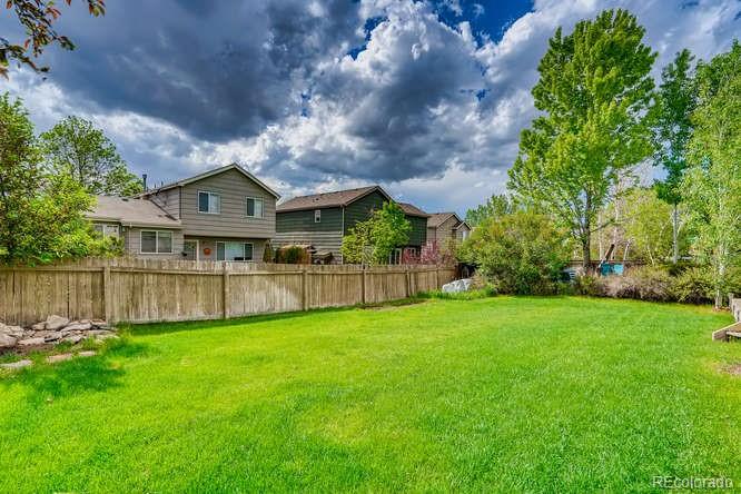 11181 Rodeo Circle Parker, CO 80138 - Photo 26 of 26 a view of a big yard next to a house