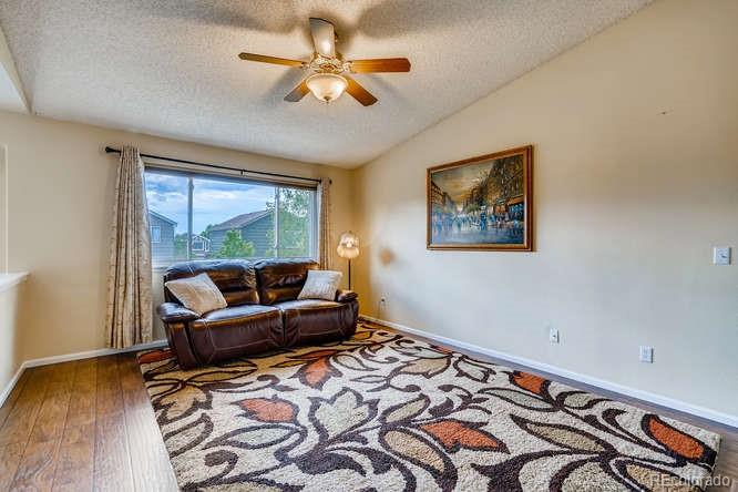 11181 Rodeo Circle Parker, CO 80138 - Photo 10 of 26 a living room with a couch and a window