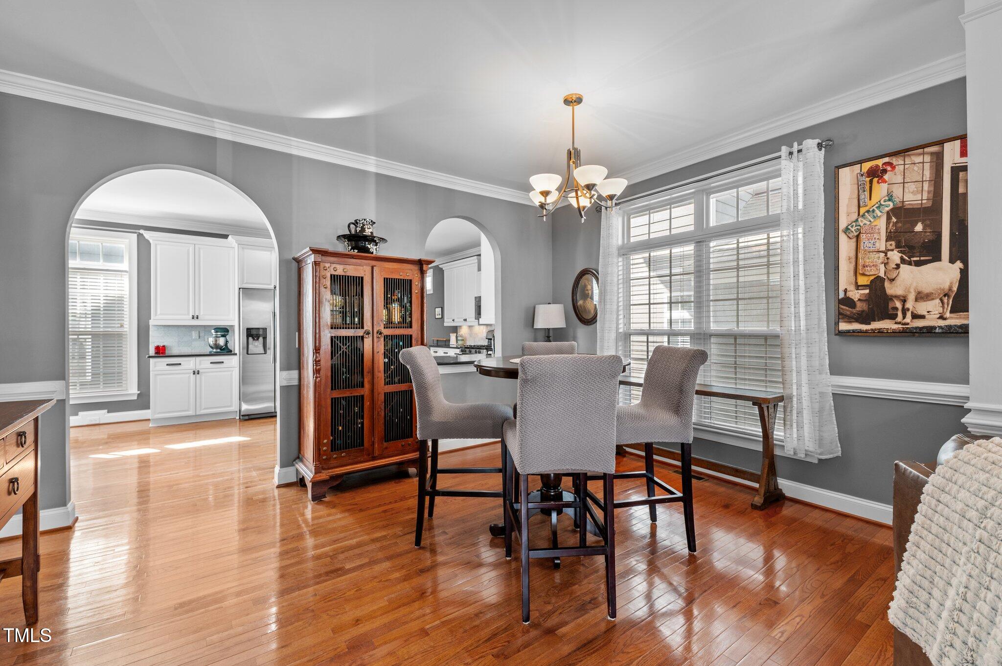 1209 Harp Street Raleigh, NC 27604 - Photo 12 of 39 a view of a dining room with furniture window and wooden floor