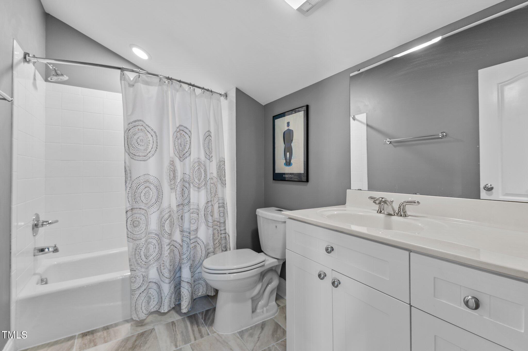 1209 Harp Street Raleigh, NC 27604 - Photo 23 of 39 a bathroom with a sink toilet and shower