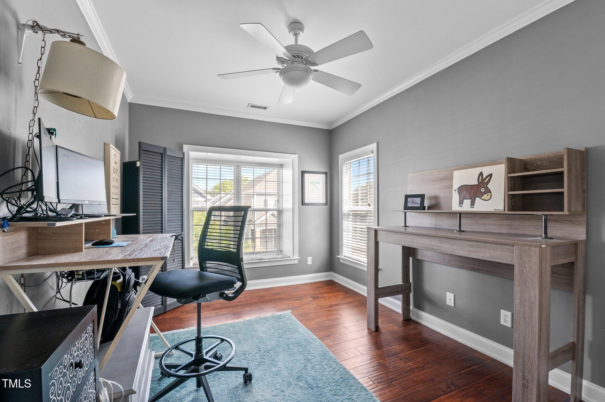 1209 Harp Street Raleigh, NC 27604 - Photo 25 of 39 a living room with furniture a fireplace and a flat screen tv