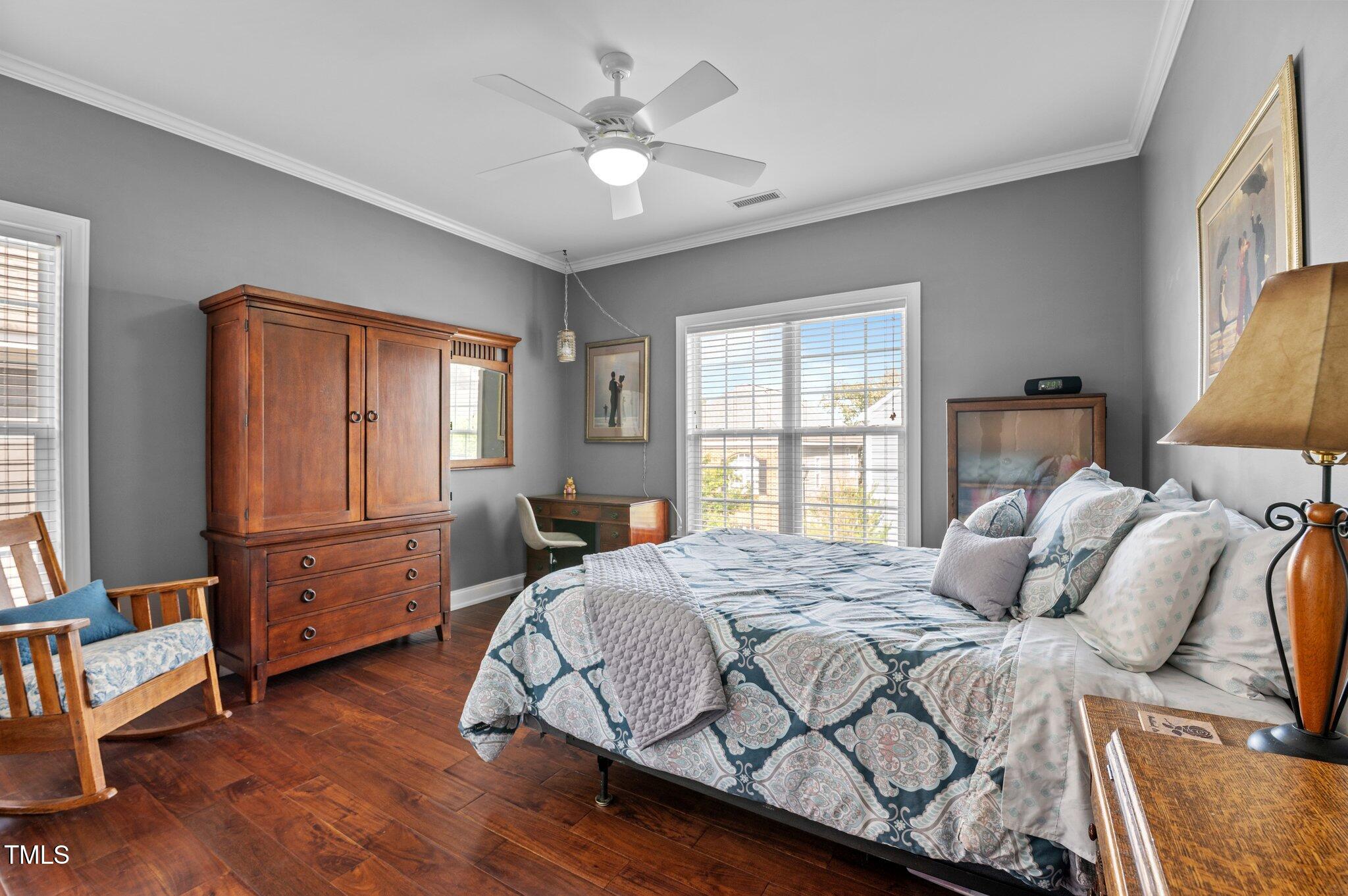 1209 Harp Street Raleigh, NC 27604 - Photo 26 of 39 a bedroom with a bed and wooden floor