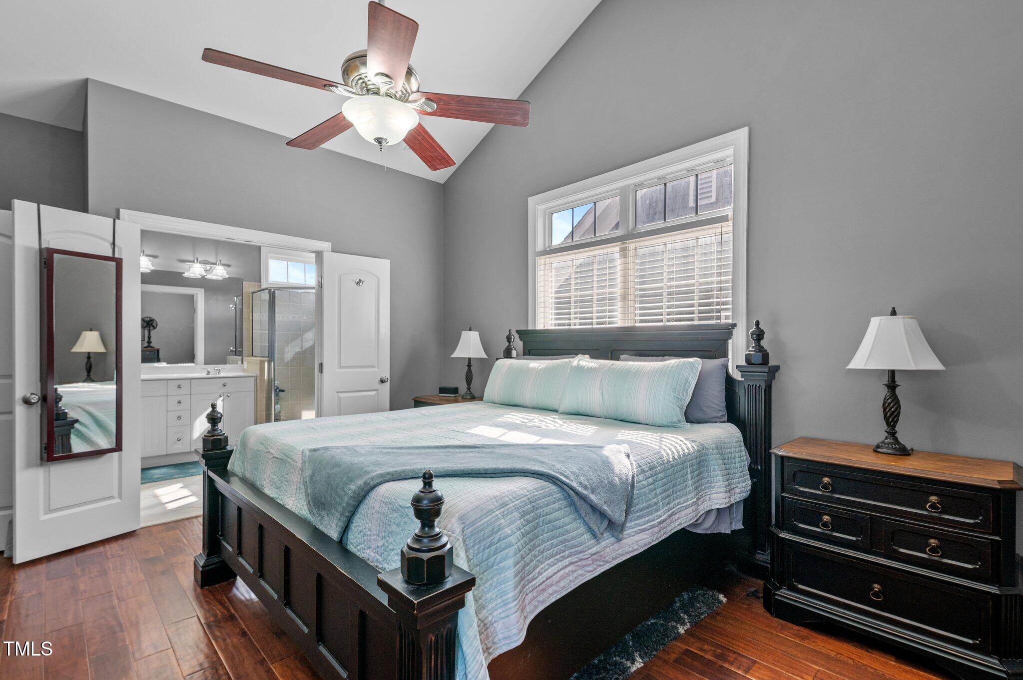 1209 Harp Street Raleigh, NC 27604 - Photo 35 of 39 a bedroom with a bed and wooden floor