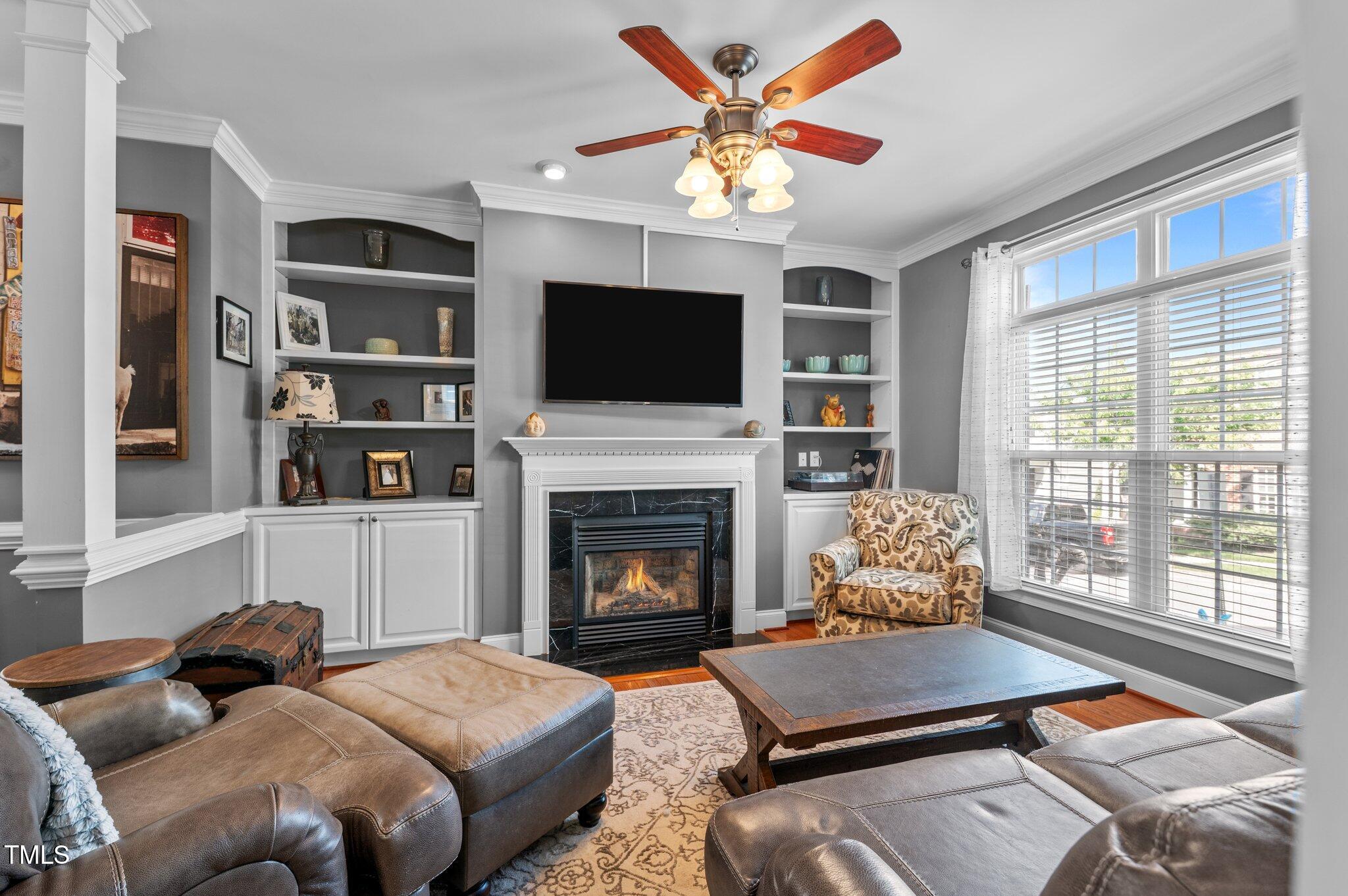 1209 Harp Street Raleigh, NC 27604 - Photo 10 of 39 a living room with furniture fireplace and flat screen tv