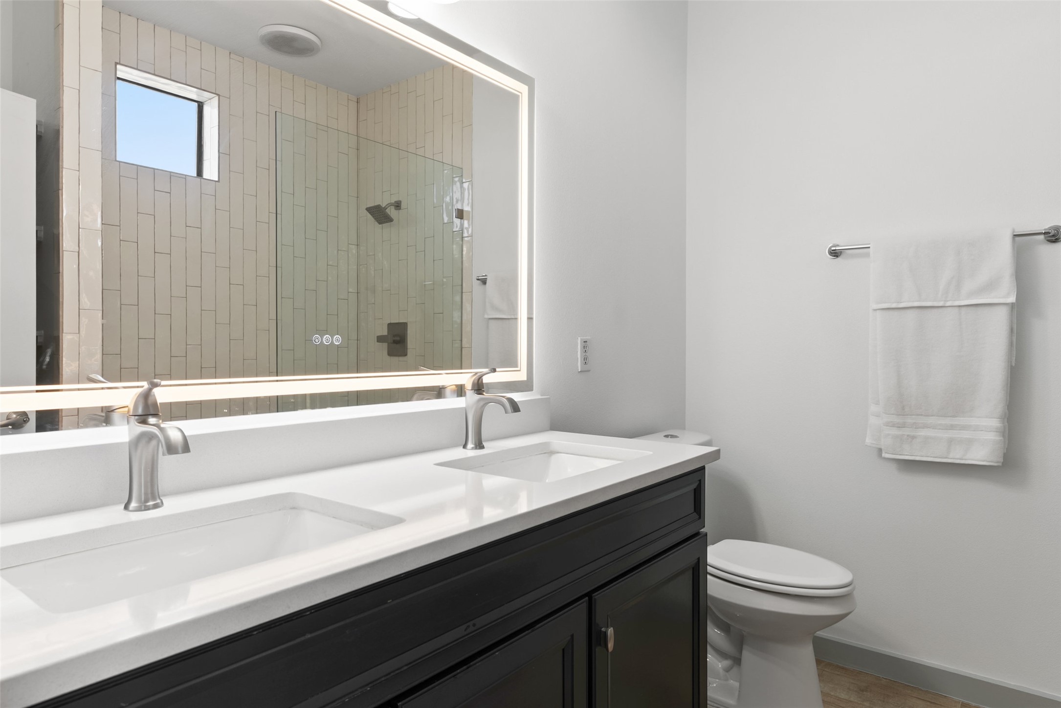 6000 South Congress Avenue, Unit 201 Austin, TX 78745 - Photo 11 of 23 a bathroom with a sink a toilet and a mirror