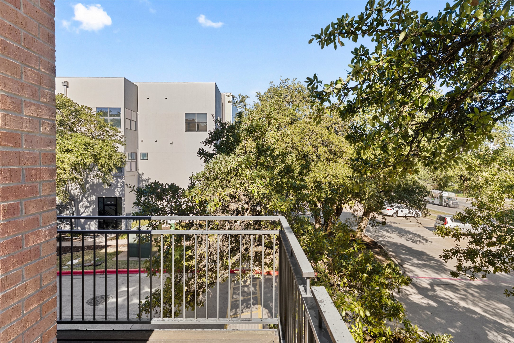 6000 South Congress Avenue, Unit 201 Austin, TX 78745 - Photo 16 of 23 a view of balcony with wooden floor and city view