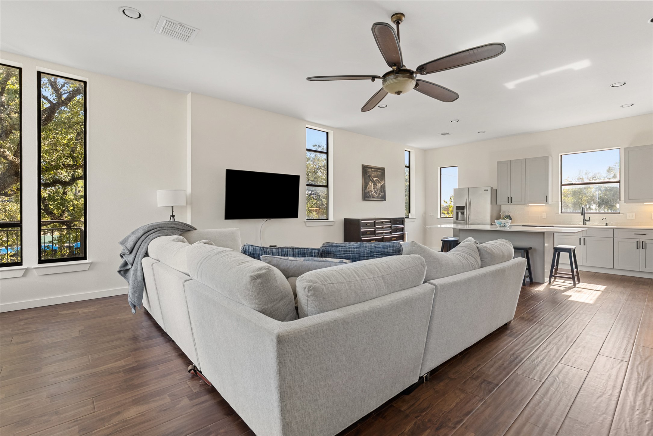 6000 South Congress Avenue, Unit 201 Austin, TX 78745 - Photo 5 of 23 a living room with furniture and a flat screen tv with wooden floor