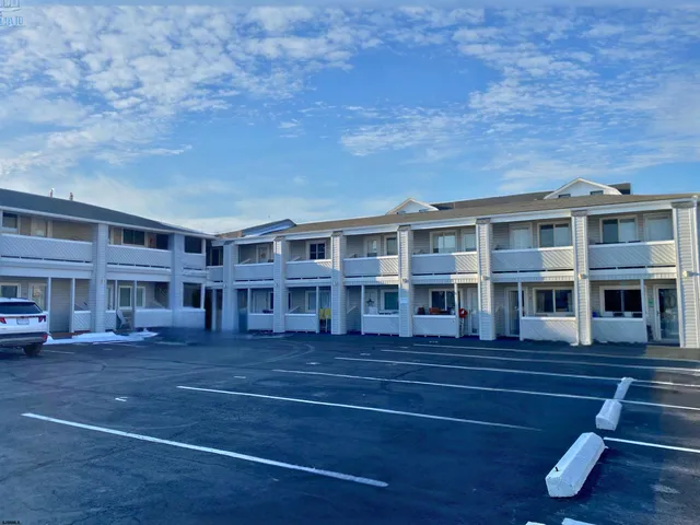 a front view of residential houses with yard