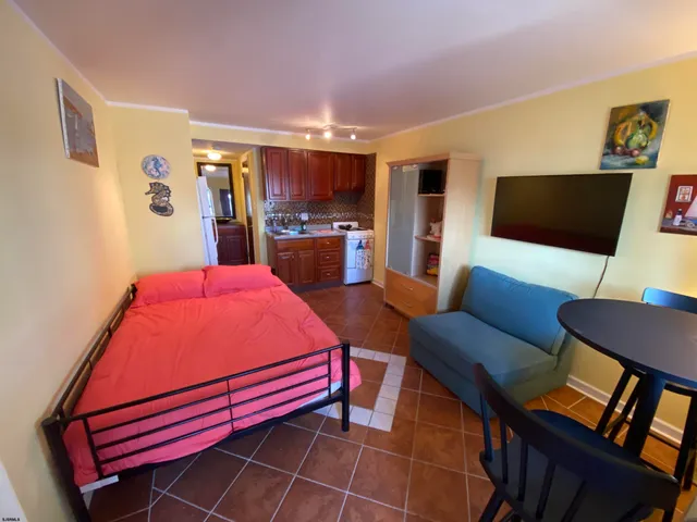 a room with furniture and a flat screen tv