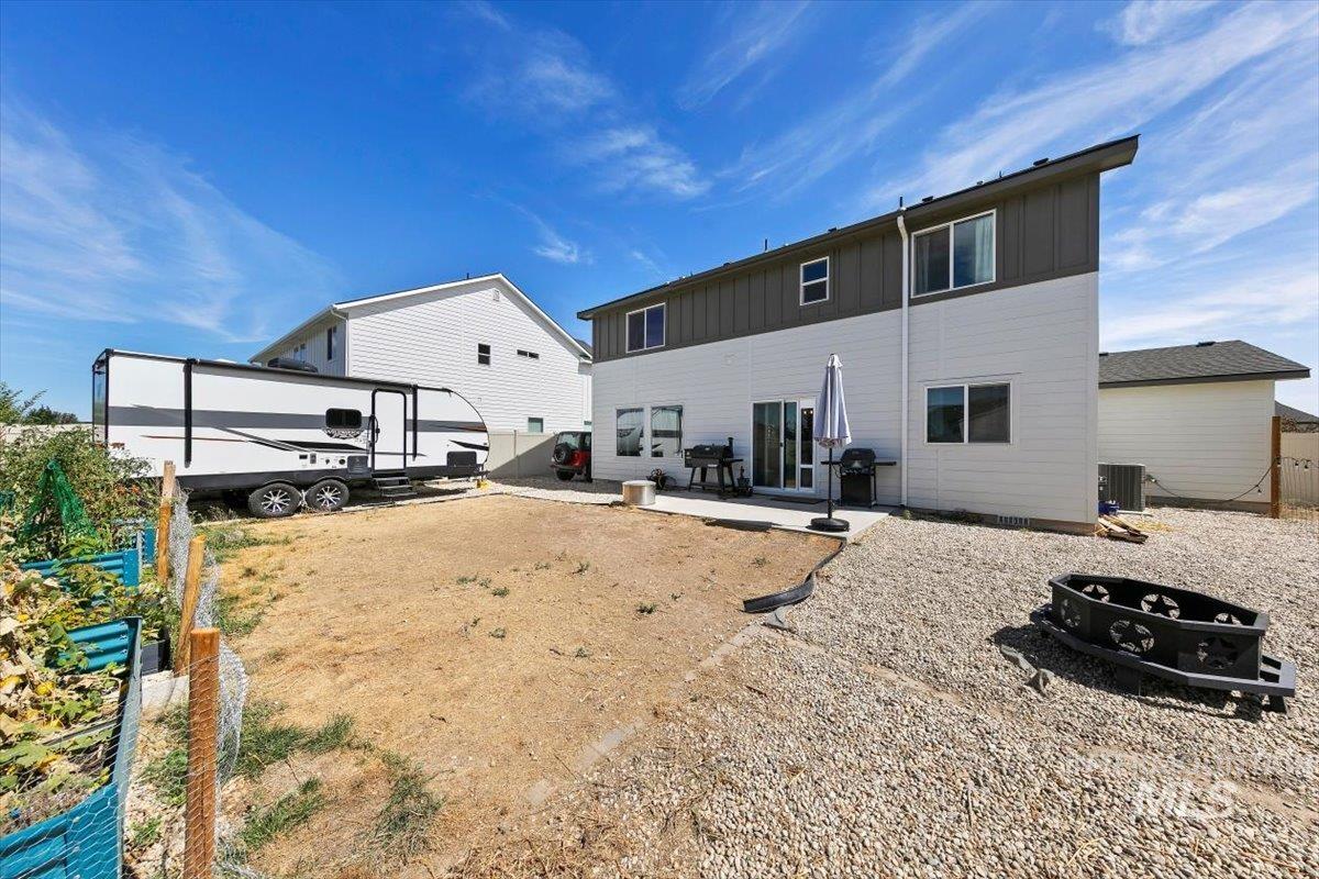 8575 South Foraker Way Kuna, ID 83634 - Photo 32 of 43 Contemporary exterior with multi-pane windows and a sliding glass door