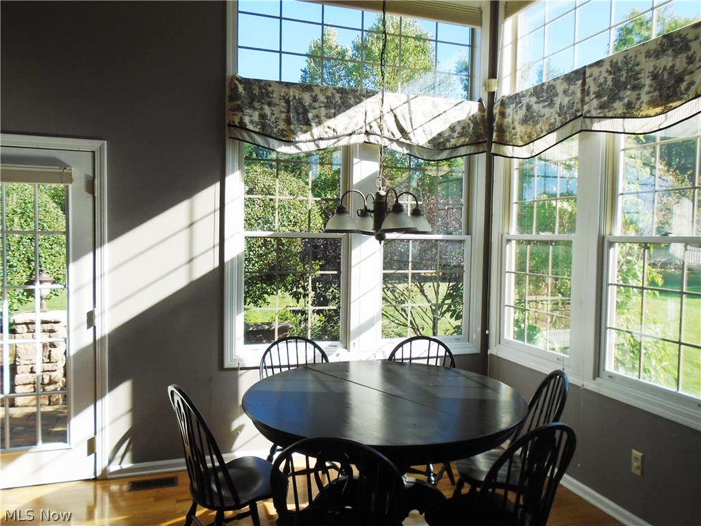 4205 Devonshire Akron, OH 44321 - Photo 10 of 35 Dinette area included in this 22 foot kitchen. Glass french door leads to stamped patio and backyard.Transom windows over corner windows just beams the sunlight in.