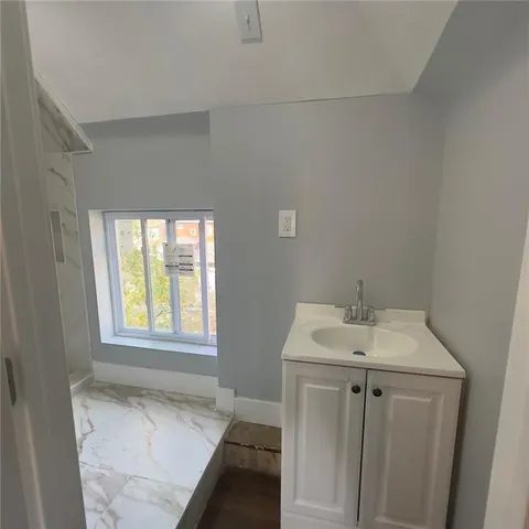 a bathroom with a sink and vanity