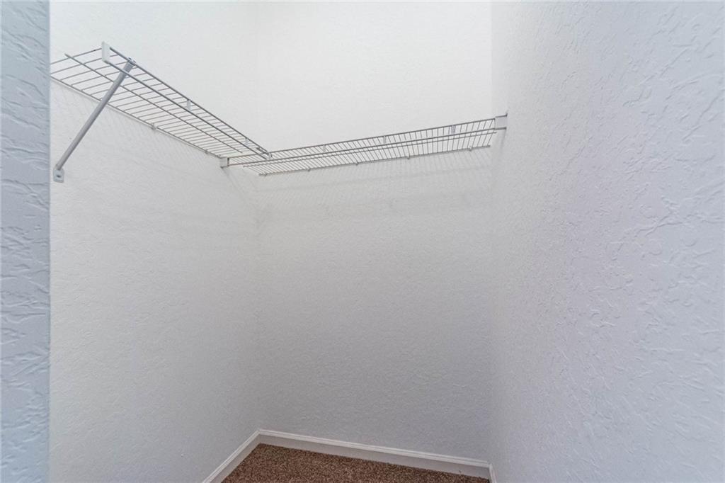 5544 Spanish River Road Fort Pierce, FL 34951 - Photo 18 of 35 a view of a room with racks on the wall