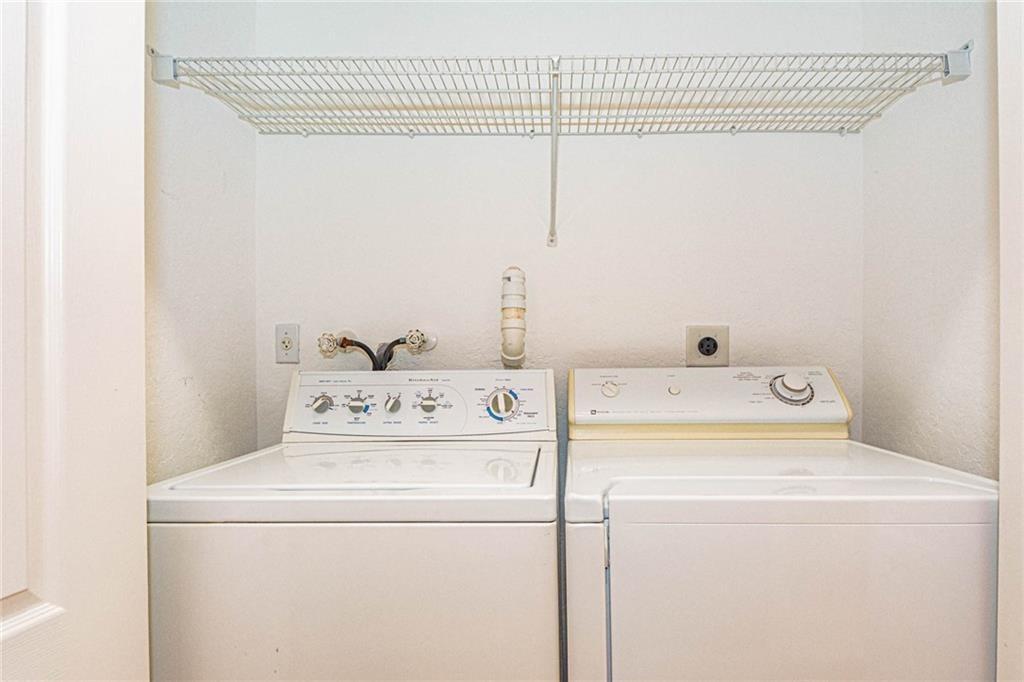 5544 Spanish River Road Fort Pierce, FL 34951 - Photo 24 of 35 a utility room with dryer and washer