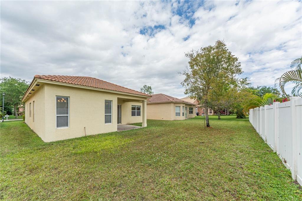 5544 Spanish River Road Fort Pierce, FL 34951 - Photo 28 of 35 a view of a house with a yard