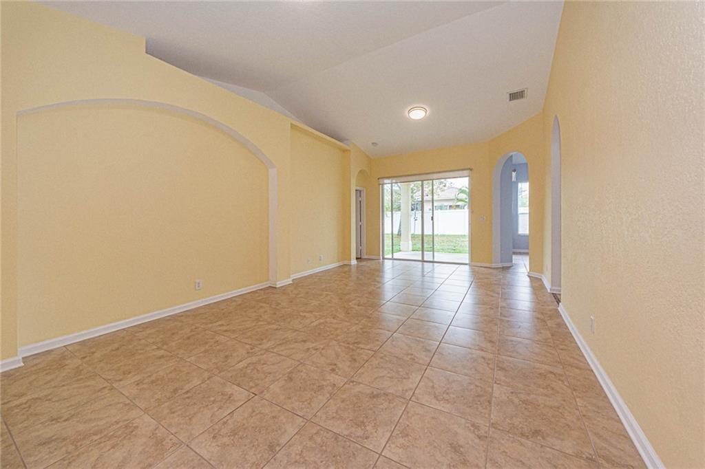 5544 Spanish River Road Fort Pierce, FL 34951 - Photo 3 of 35 a view of an empty room with glass door