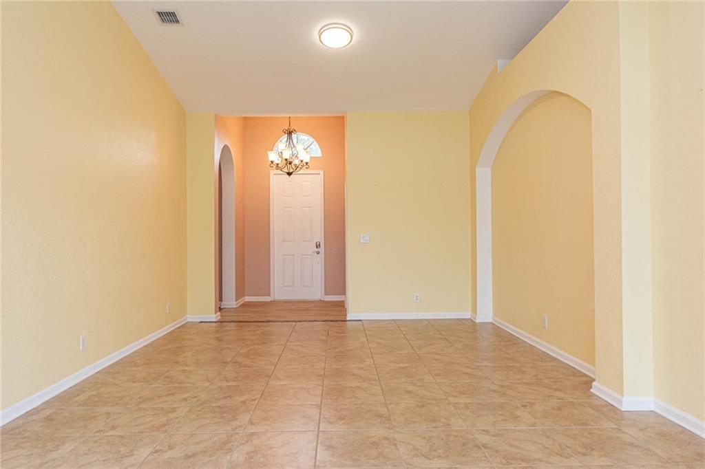 5544 Spanish River Road Fort Pierce, FL 34951 - Photo 5 of 35 an empty room with windows