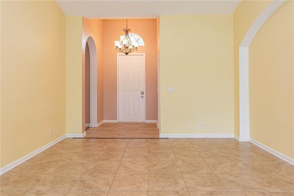 5544 Spanish River Road Fort Pierce, FL 34951 - Photo 6 of 35 an empty room with a door