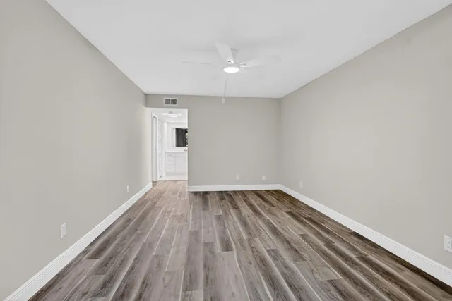 a view of washer and dryer with kitchen view