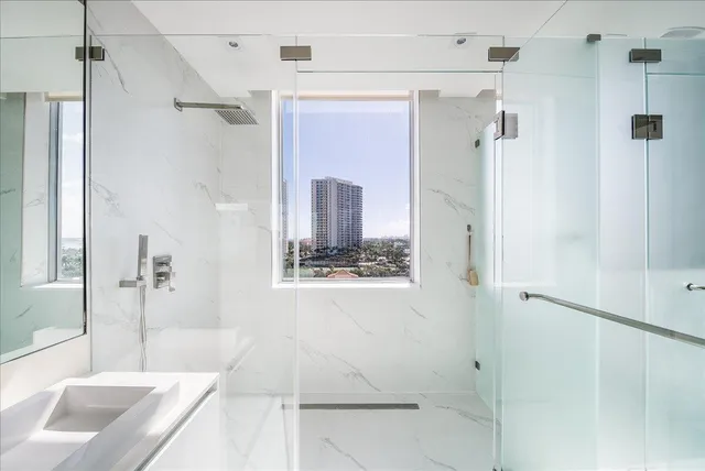 a white toilet sitting next to a bathroom sink