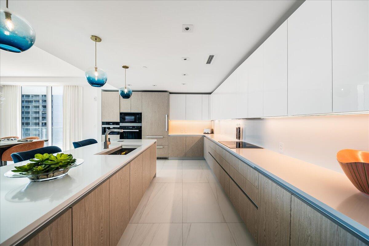 3100 North Ocean Drive, Unit P905 Singer Island, FL 33404 - Photo 3 of 42 a large kitchen with stainless steel appliances lots of counter space and a sink