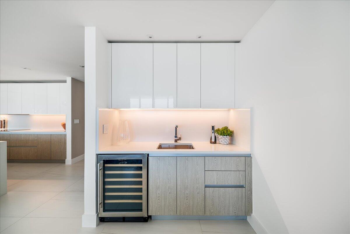 3100 North Ocean Drive, Unit P905 Singer Island, FL 33404 - Photo 9 of 42 a room with a lamp and a window