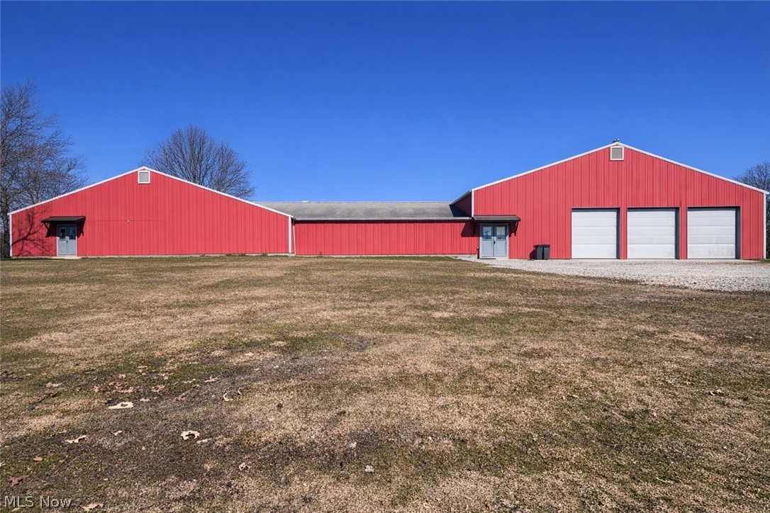22840 Buck Road Alliance, OH 44601 - Photo 24 of 36 View of an outdoor structure, an outbuilding, a garage, and driveway