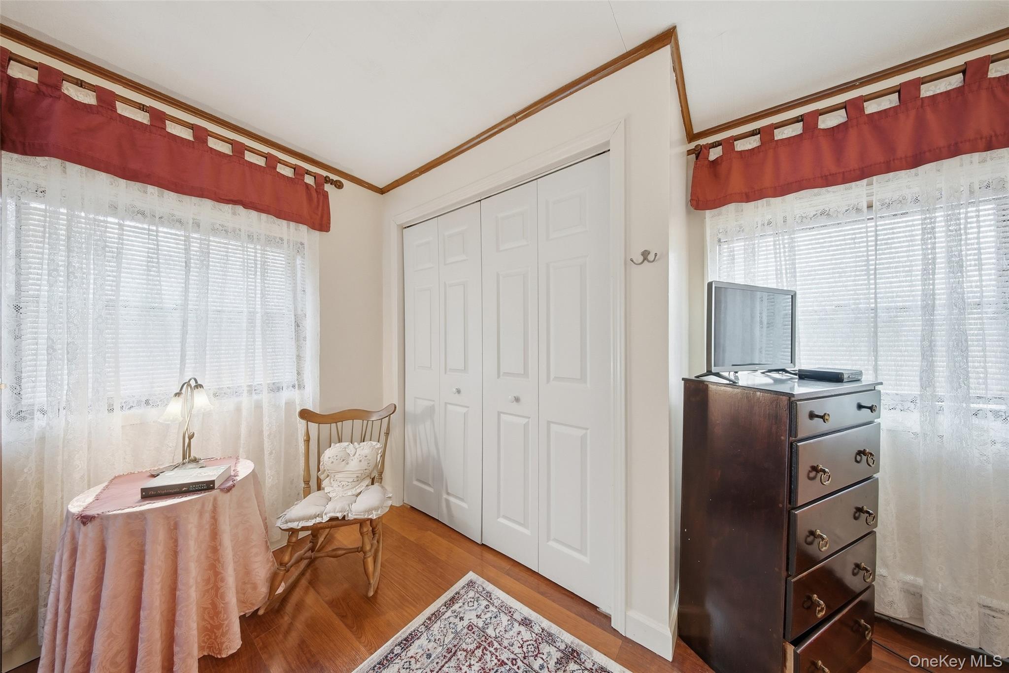 5003 Searsville Road Pine Bush, NY 12566 - Photo 14 of 40 a bedroom with a bed and wooden cabinets