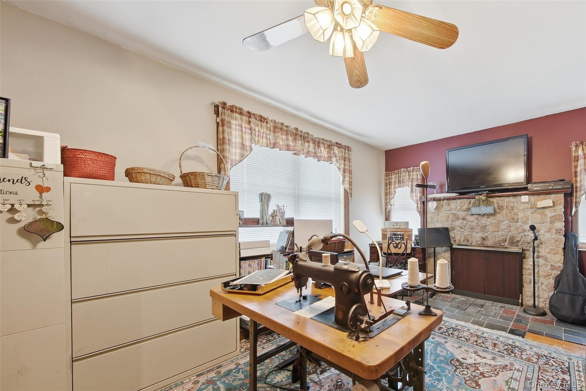 5003 Searsville Road Pine Bush, NY 12566 - Photo 20 of 40 a living room with furniture a flat screen tv and a fireplace