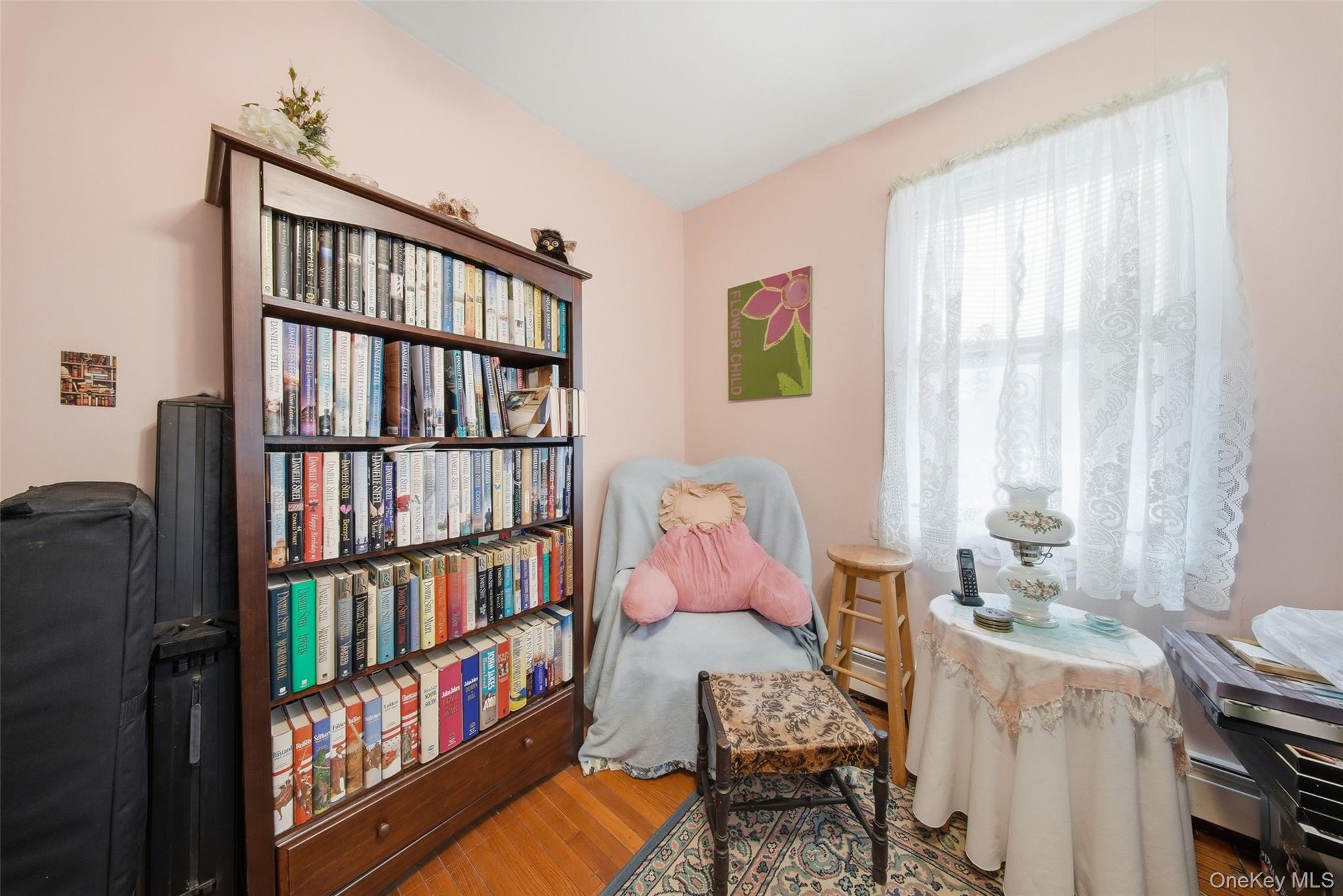 5003 Searsville Road Pine Bush, NY 12566 - Photo 21 of 40 a bedroom with furniture a book shelf and a window
