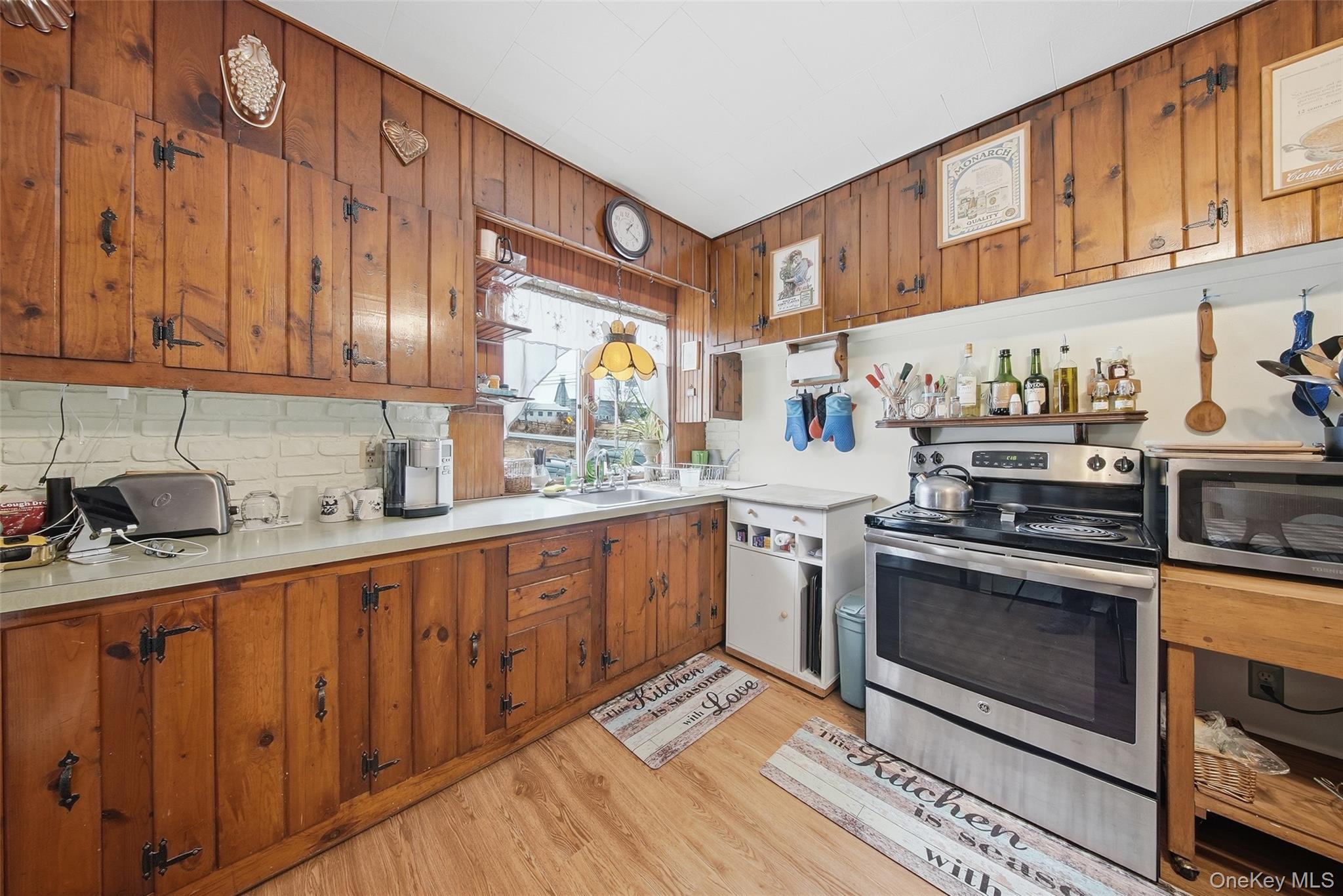 5003 Searsville Road Pine Bush, NY 12566 - Photo 10 of 40 a kitchen with stainless steel appliances granite countertop a stove a sink and a microwave
