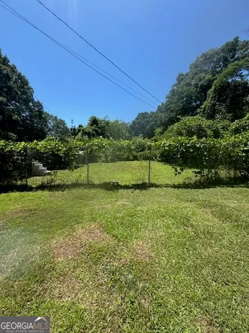 a view of backyard with green space
