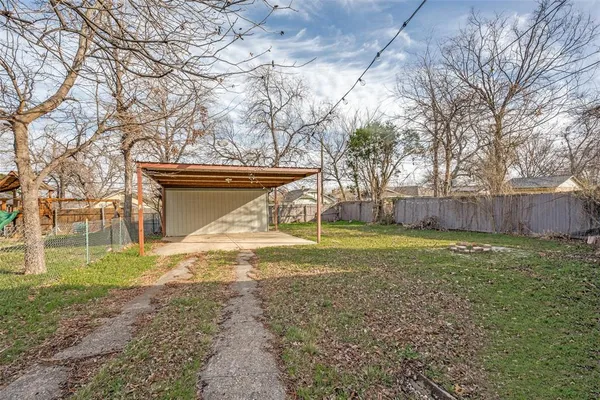 a view of a yard with tree s