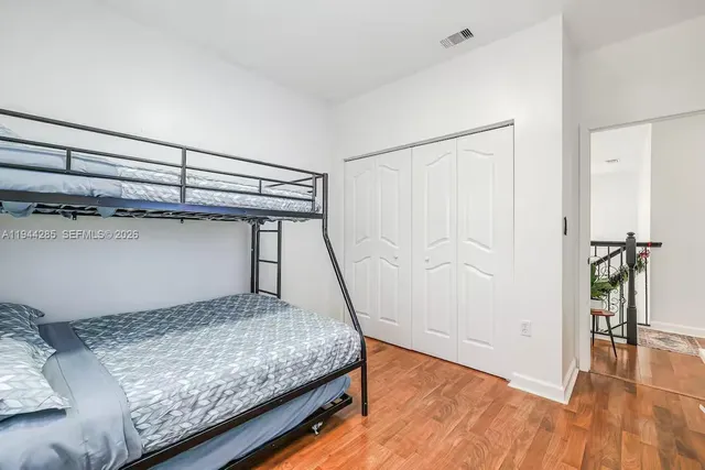 a bedroom with a bed and a table