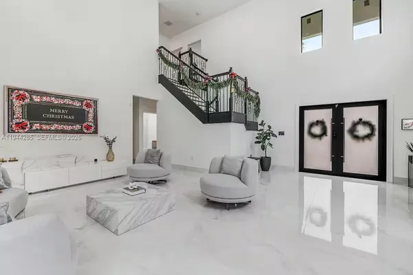 a living room with furniture and white walls