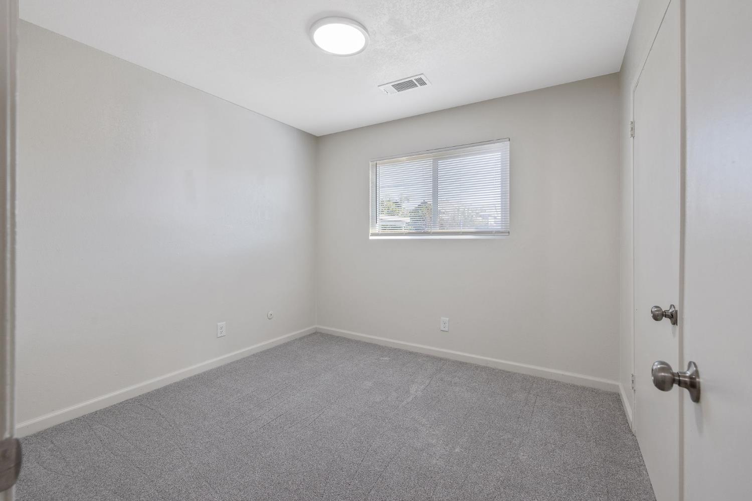 1432 North Locust Street Visalia, CA 93291 - Photo 26 of 37 an empty room with a window