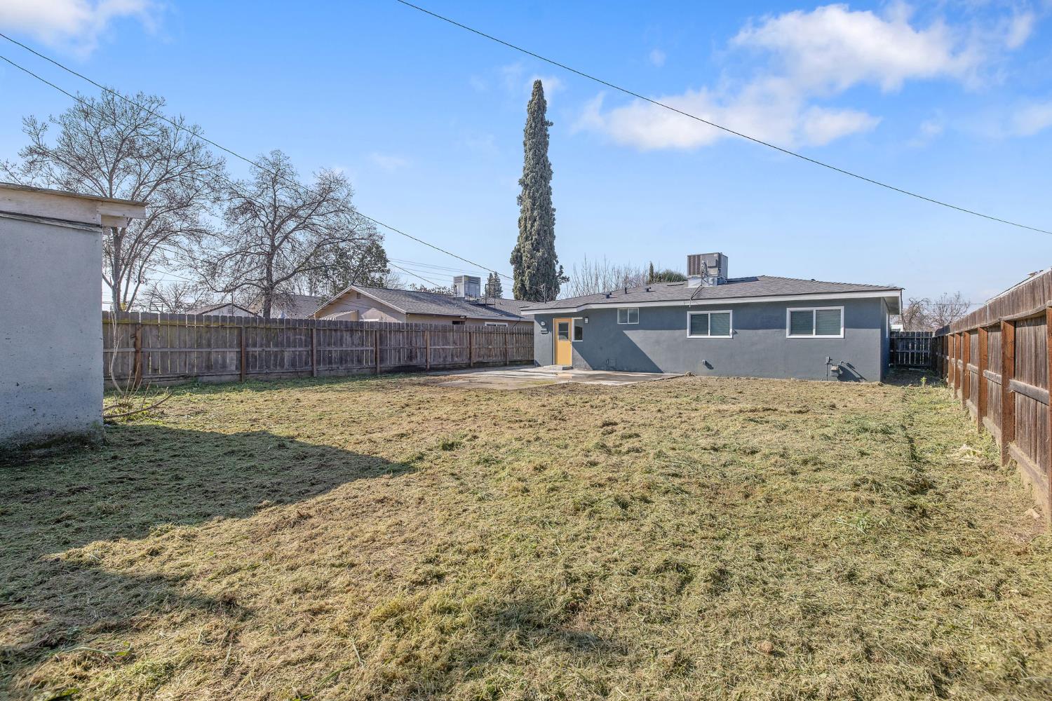 1432 North Locust Street Visalia, CA 93291 - Photo 32 of 37 a view of house with a yard